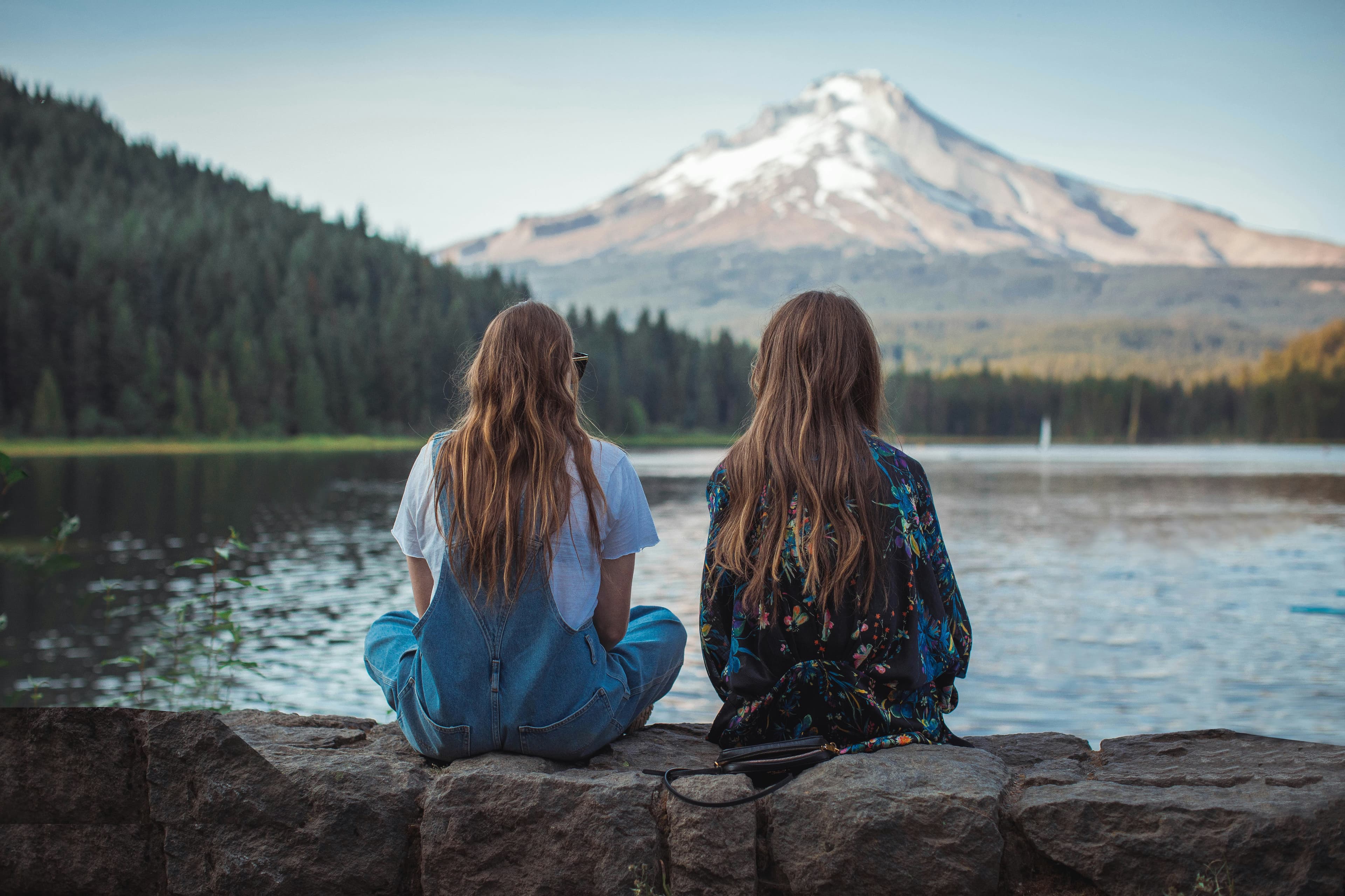 Two friends sharing a quiet moment outdoors